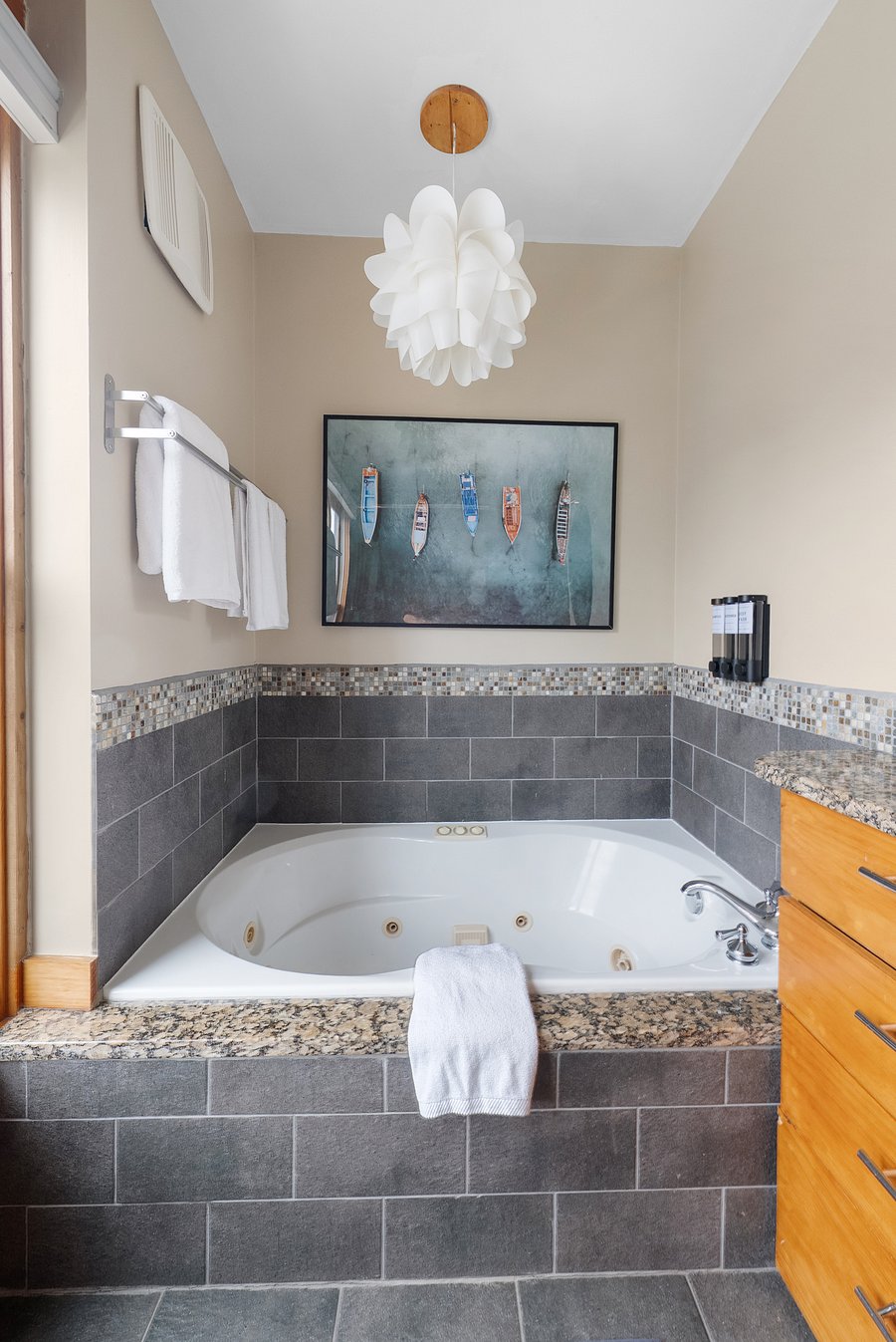 Relaxing jetted soaking tub in the spacious ensuite bathroom.