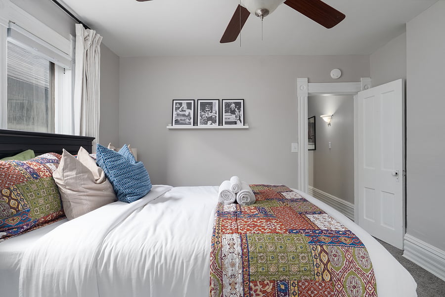 Fresh linens and thoughtful touches await in the primary bedroom
