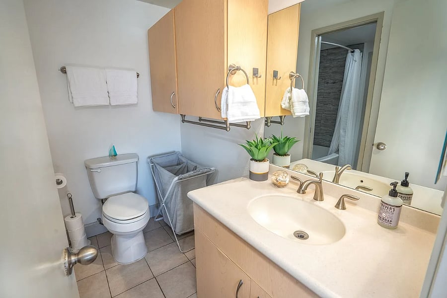 Master bathroom has great cabinet storage below and above