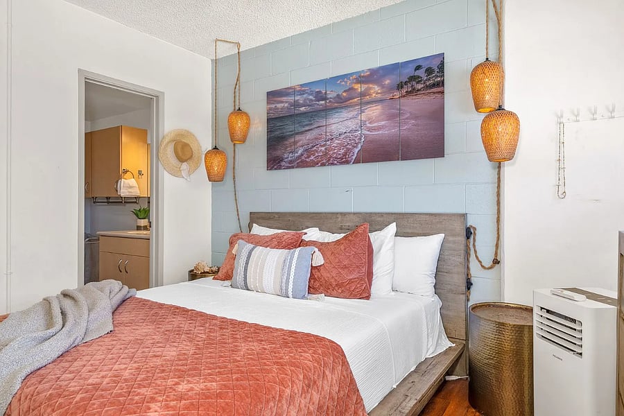 Master bedroom bed is luxurious, there is also an air conditioner floor unit in here and we love the fun lights by the bed for ambiance.