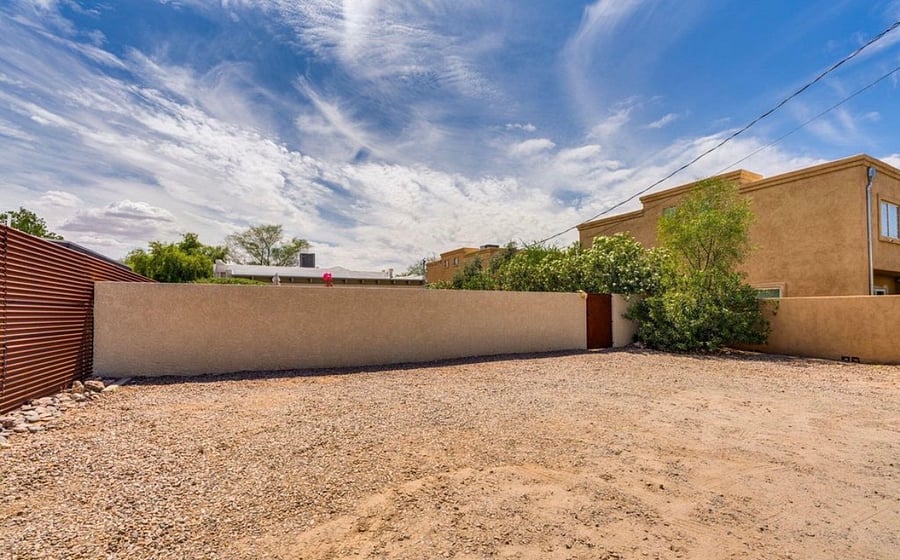 4 private parking spaces off the rear alley. Enter the fully gated property via locked security gate.