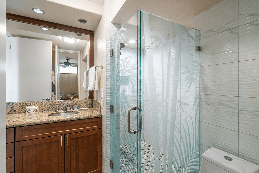 Remodeled bathroom with a spacious walk-in shower and plenty of vanity space.