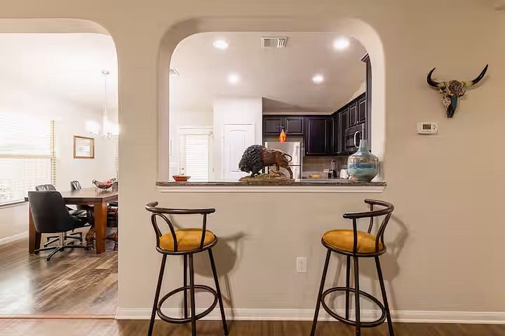 counter area with 2 barstools