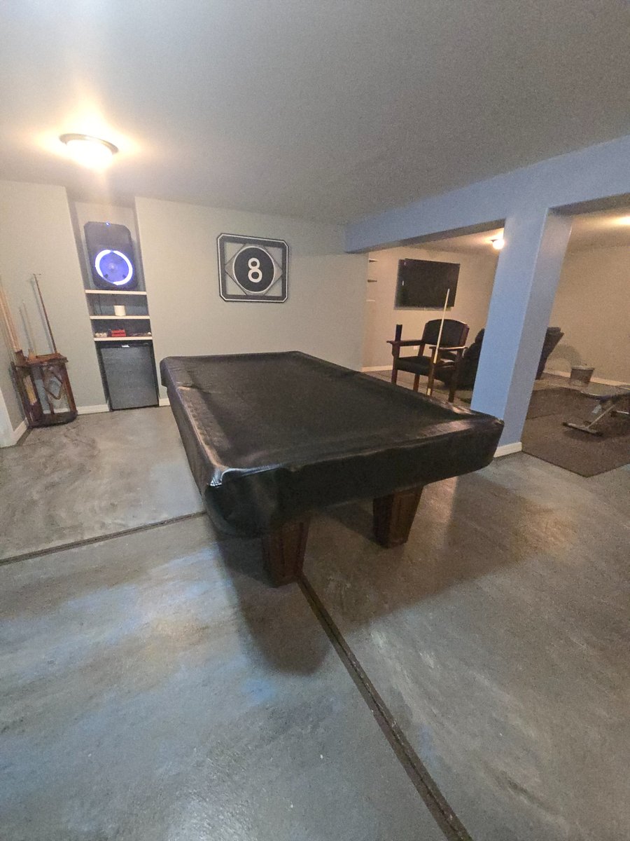 Basement:  Pool table (covered)