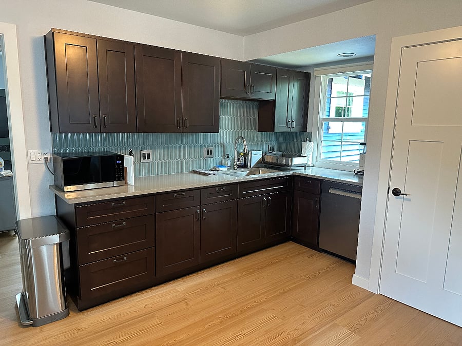 View of the open kitchen with island moved under the window.