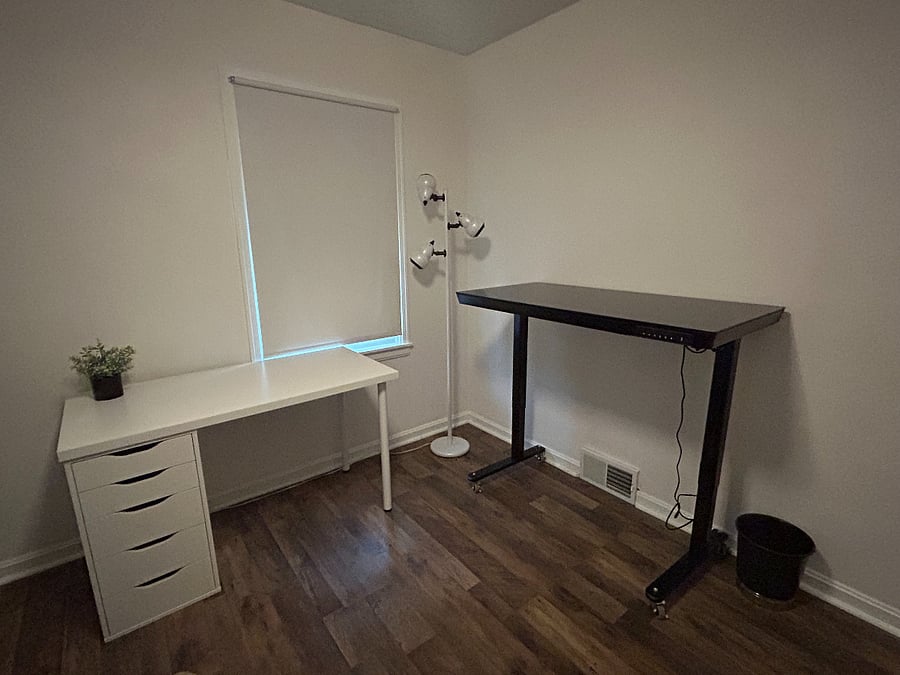 Private office with standard desk and adjustable standing desk