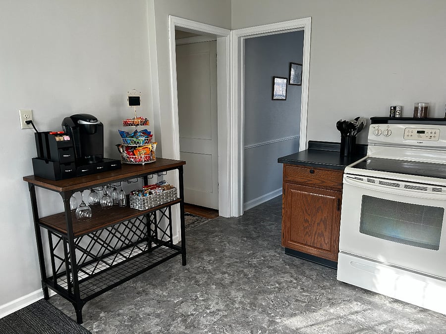 Fully stocked kitchen; stove/oven, refrigerator, dishwasher, microwave, Keurig coffee maker, blender, tea kettle, baking items, cooking essentials, dishes, glasses, flatware, and more