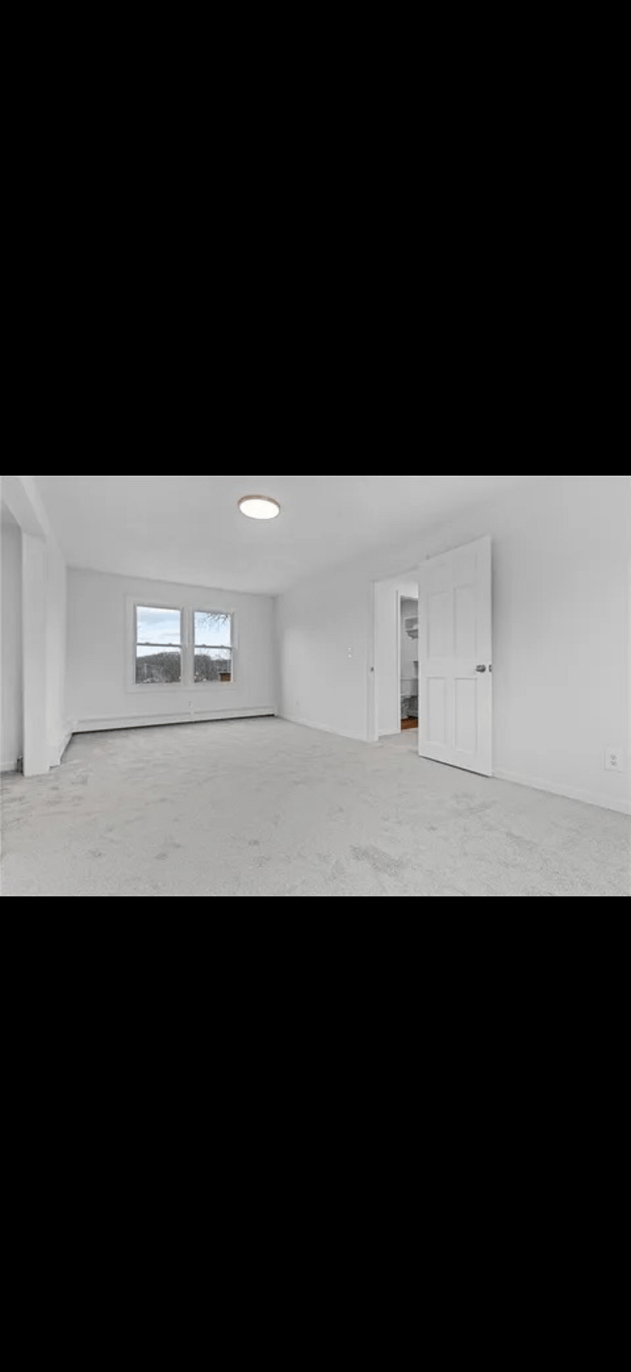 This room features a king bed, dresser, and closet organizer.