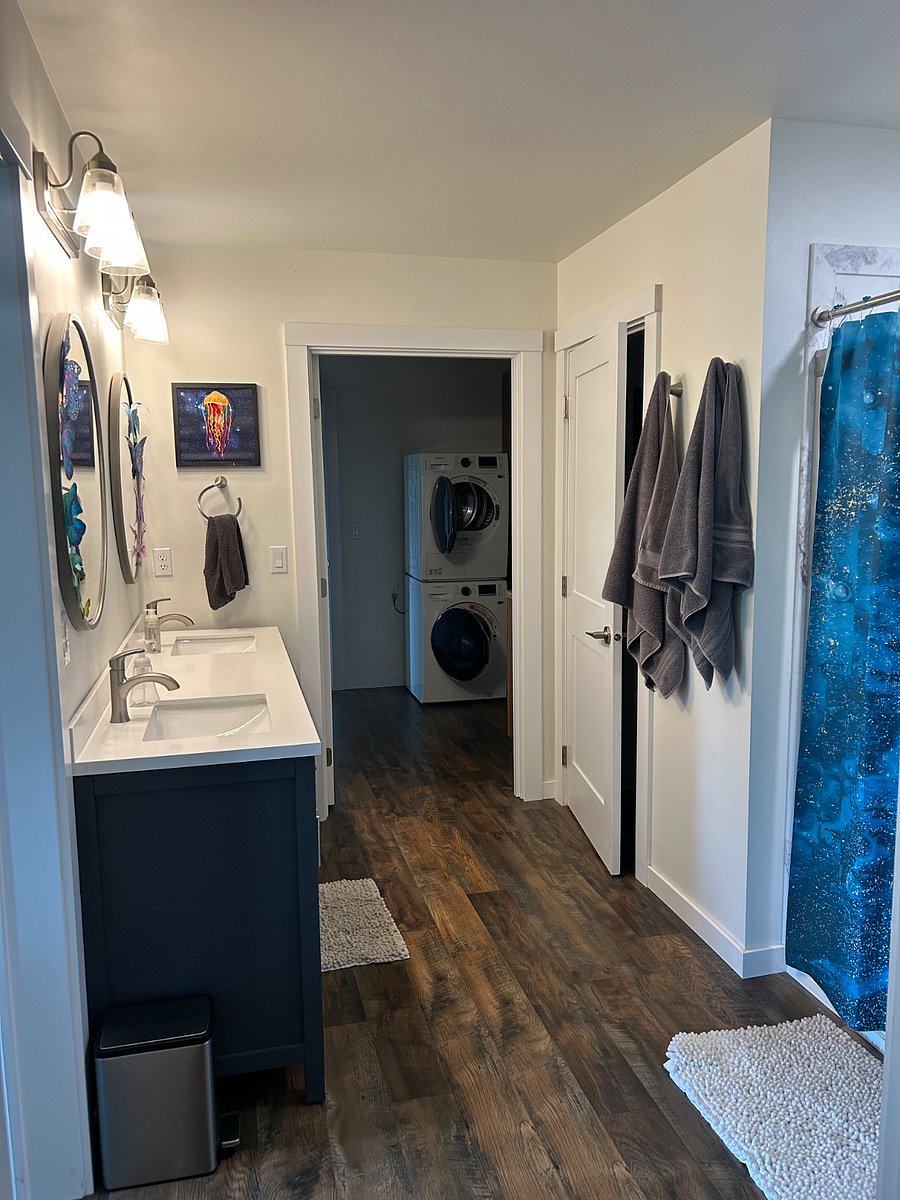 Bathroom and Laundry. Bathroom includes two sinks, separate toilet room, and walk in shower.