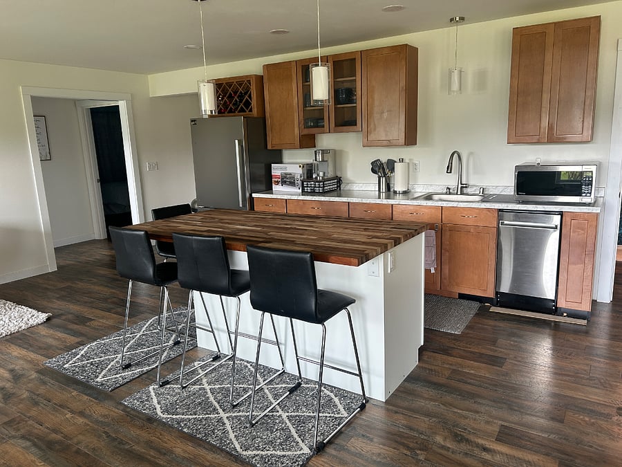 Kitchenette includes sink, DW, refrigerator, induction cooktop, and microwave. Keurig and basic kitchen essentials also provided.