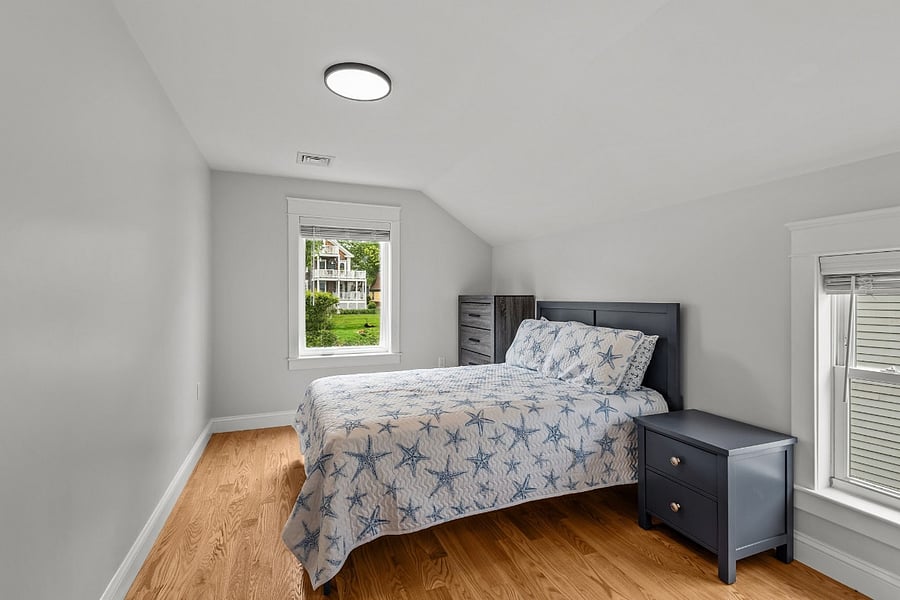 Additional bedroom featuring queen