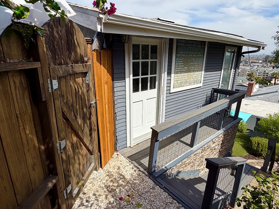 View of the locking gate, casita door and porch.