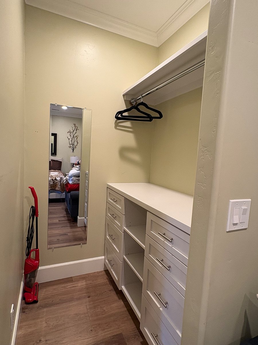 Custom built storage closet in bedroom