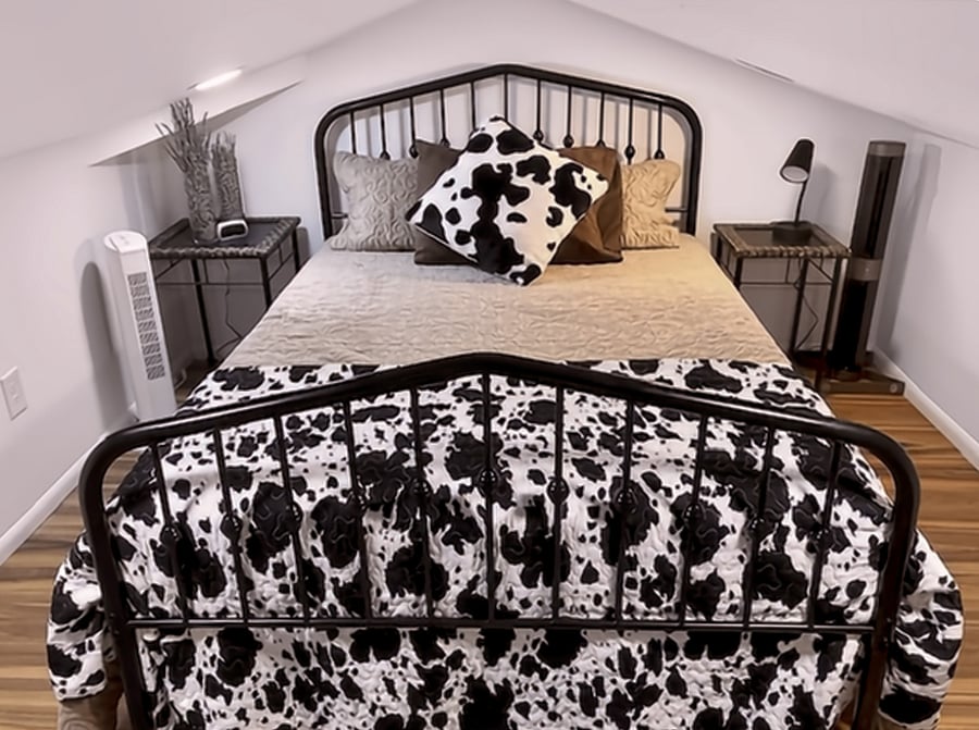 The loft is relaxed and spacious enough to fit a full-sized bed with plenty of room to move around and access storage. However, it is a loft, so you'll need to remember to watch your head!