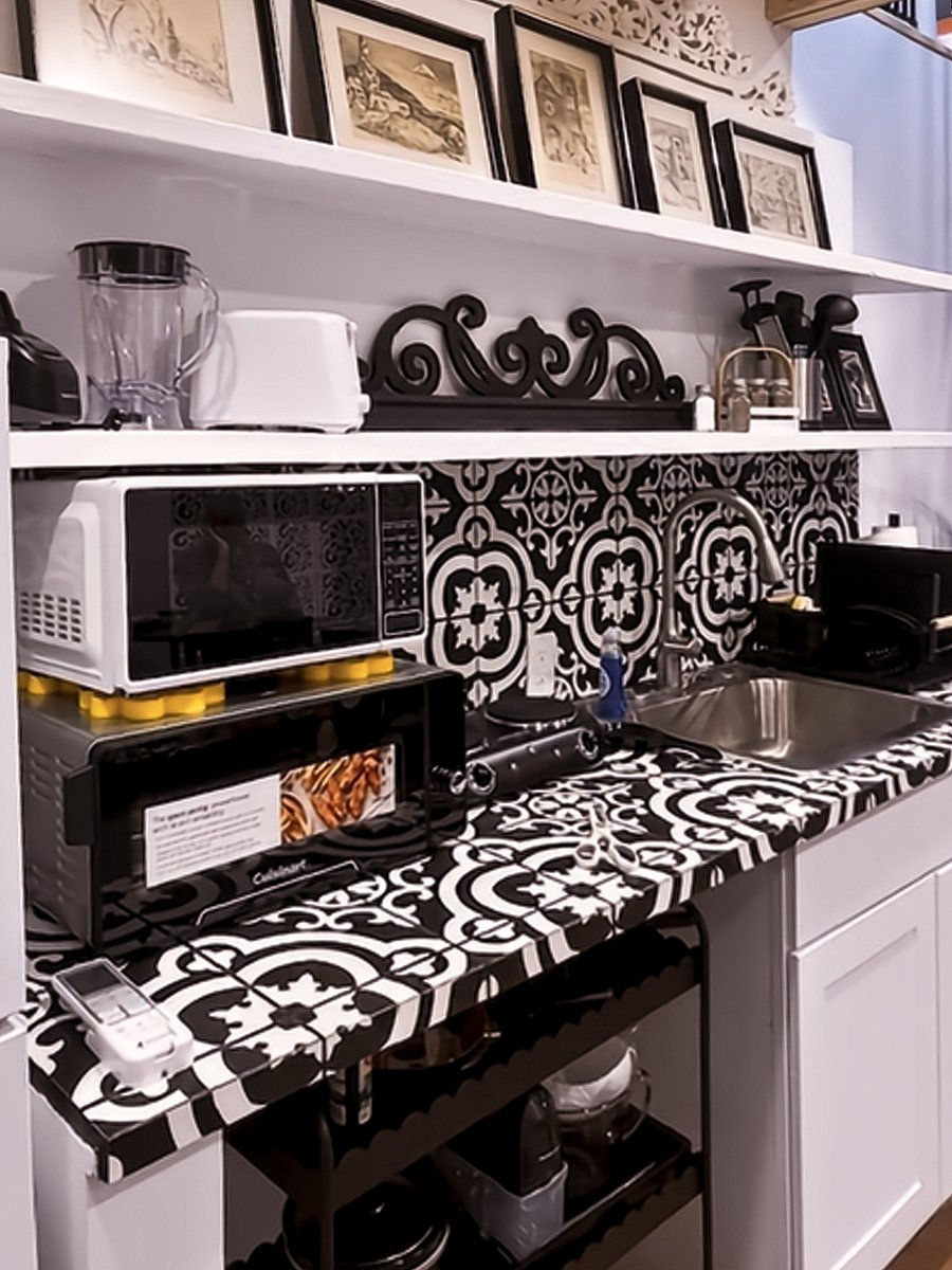 Appliances like the 5-function Cuisinart air fryer/oven, a two-burner range, a microwave, a toaster, a blender, and all the cooking and baking accessories you might need make preparing meals for one easy and fun.