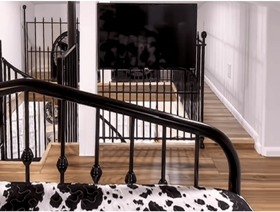 A large smart TV is mounted to be viewed perfectly from the bed, so you can enjoy your favorite entertainment upstairs as well as downstairs.