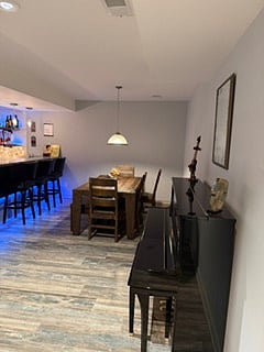 Basement seating area with Piano