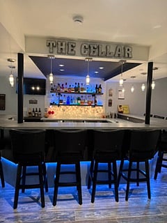 Basement Bar with 9 swivel bar stools