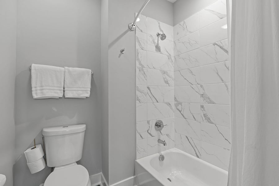 Secondary full bathroom with shower/tub combo.