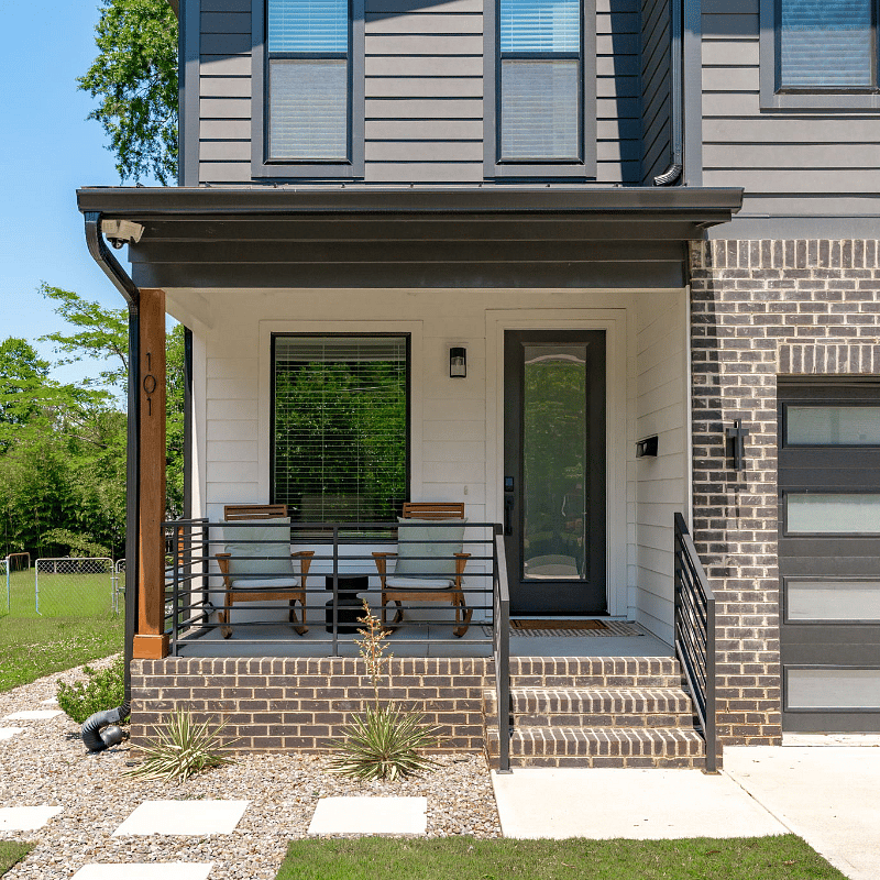 Front porch with two rocking chairs.