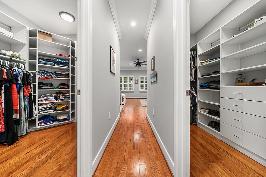 The primary suite features two custom walk-in closets.
