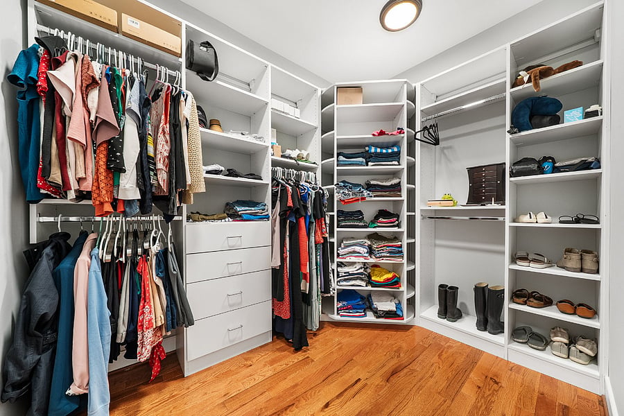 The primary suite features two custom walk-in closets.