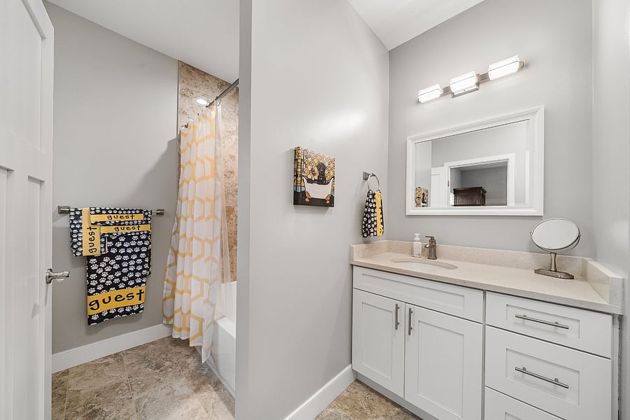 A second bedroom offers a queen bed, its own private ensuite bath, and walk-in closet.