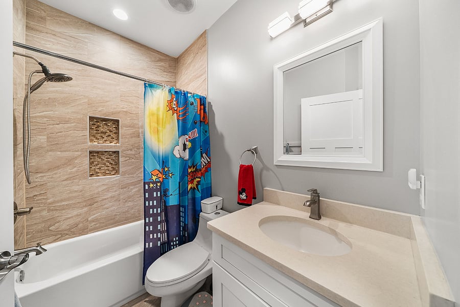 A hall bath for the 3rd and 4th bedrooms rounds out the upstairs.