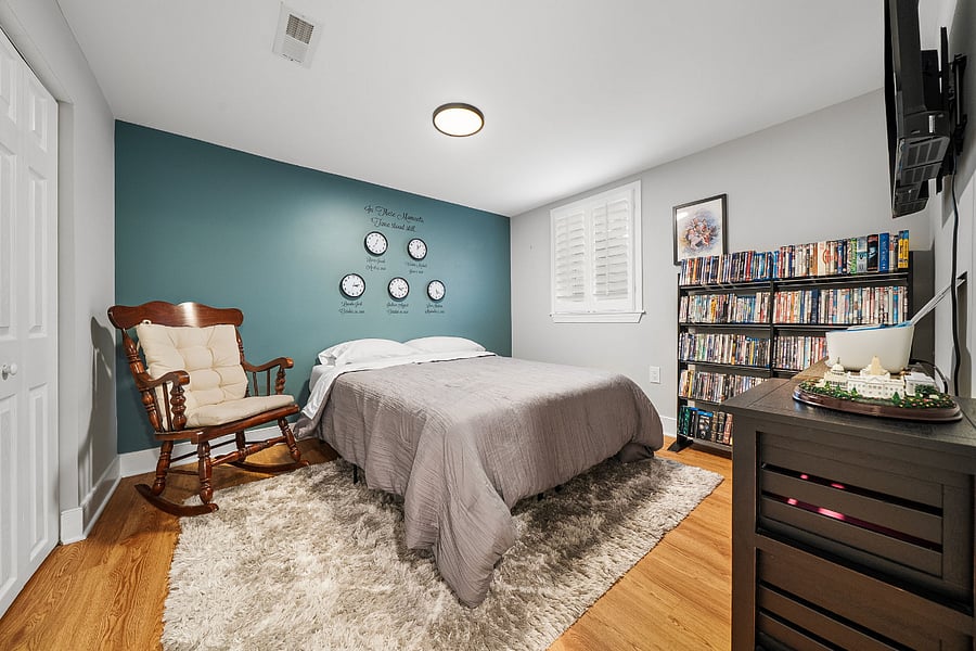The basement includes a fifth bedroom with full-sized bed and closet.