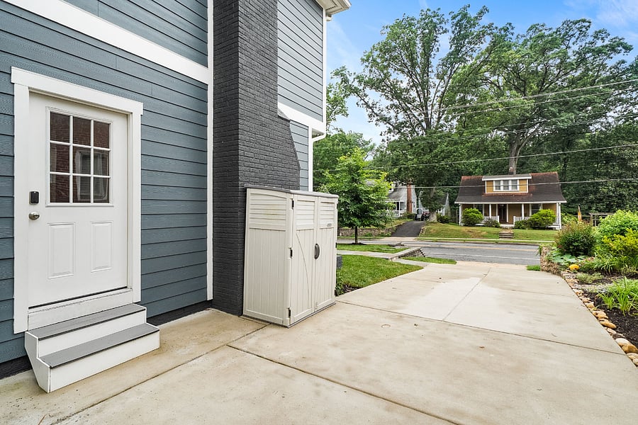 The driveway is large enough for three vehicles and leads to the home's side entrance mudroom.