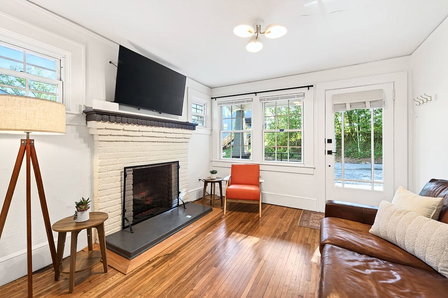 Living room with views of trees and quiet walkable street