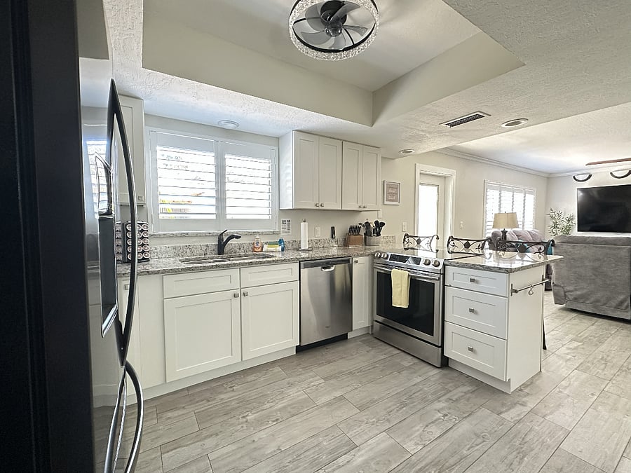 A fully equipped kitchen featuring a stove, dishwasher, and Keurig coffee maker.