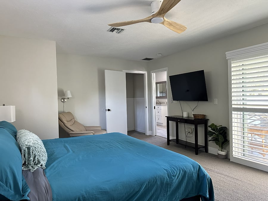 Slide open the doors to a relaxing screened-in porch and enjoy the comfort and privacy of a dedicated bathroom.