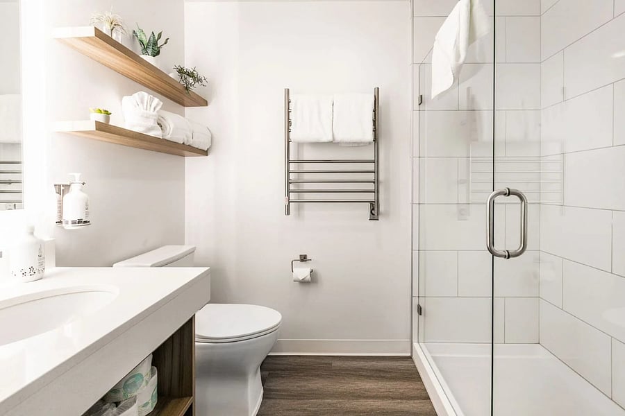 Clean elegant bathroom with cozy towel heaters!