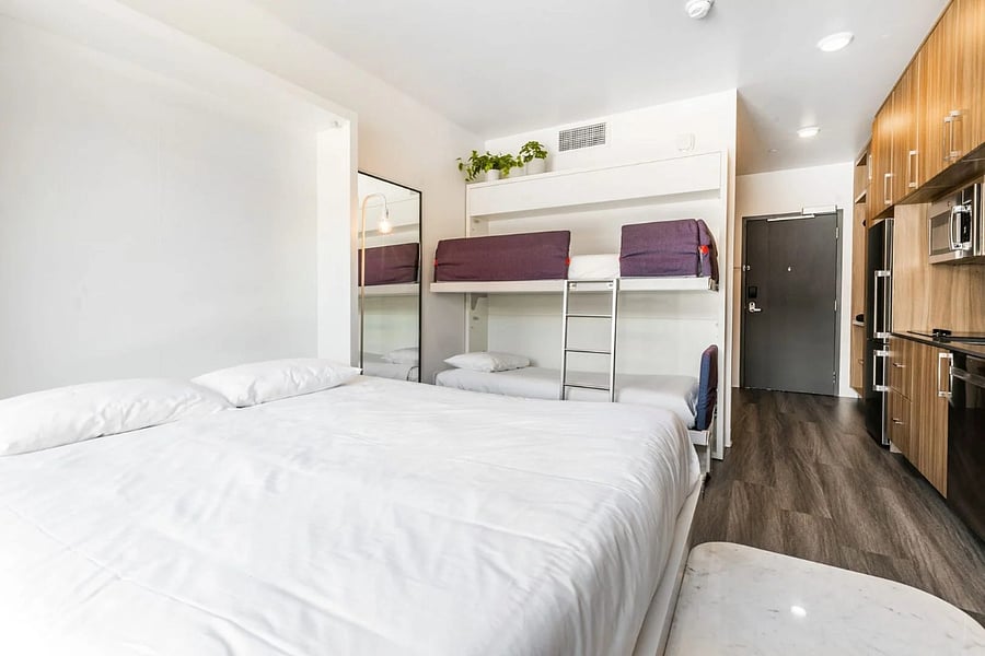 Space saving queen Murphy bed and bunk beds that disappear into the wall when not in use.