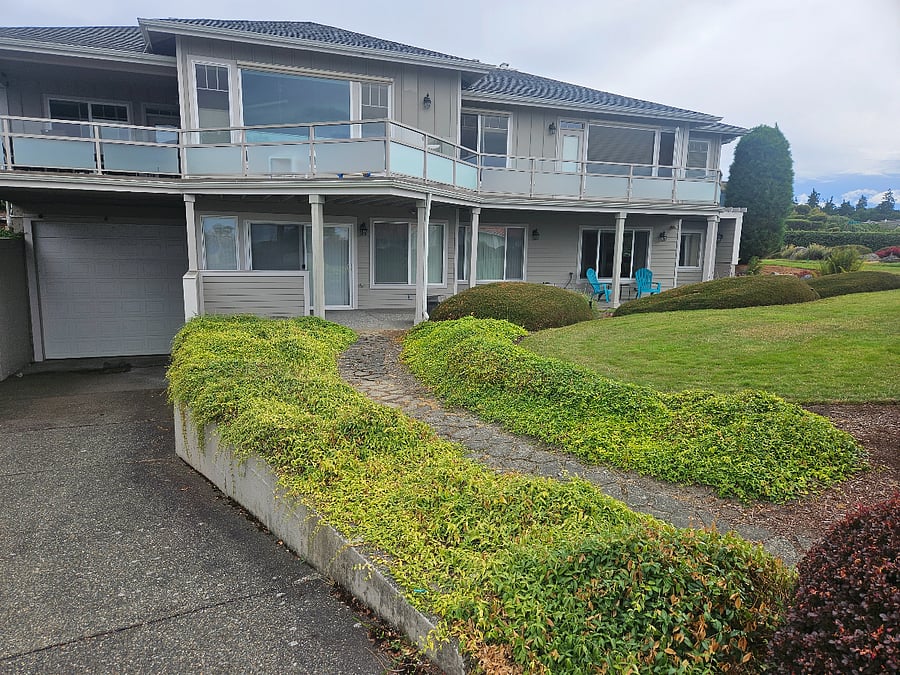 Private covered parking space for guests (left of photo in front of garage door). The rental unit is located on the lower level of our family home where the 2 blue chairs are in the photo.