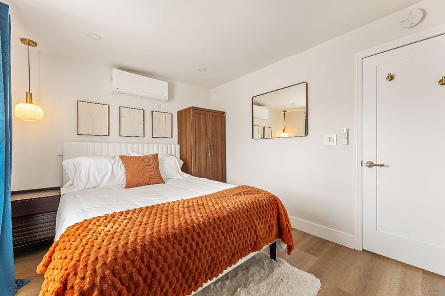Bedroom 3: Queen sized bed with wardrobe and direct access to the backyard.