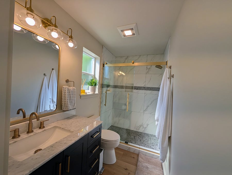 Large format tiles in shower, rain can style shower head