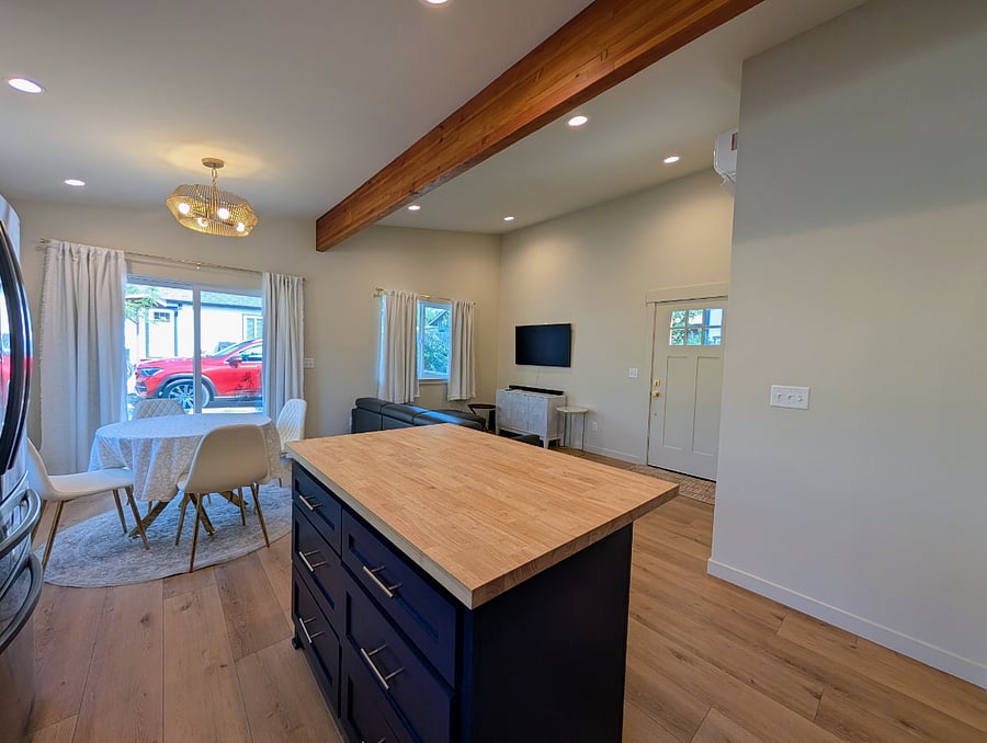 Kitchen, dining and living area with open beam and high ceilings for light and bright spaces
