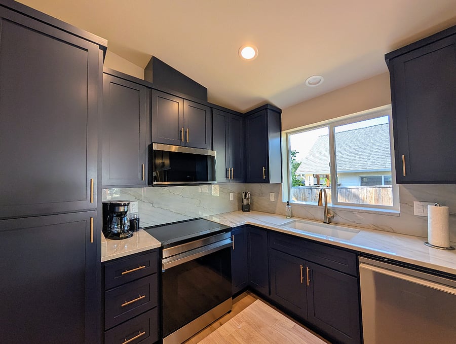 Custom cabinets with quiet close. Quartzite countertops. Samsung appliance suite with conduction cooktop (pots and pans are included)