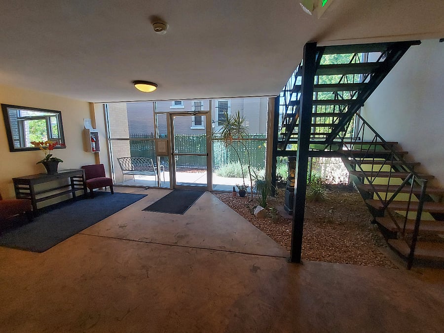 Bright shared entry with indoor garden