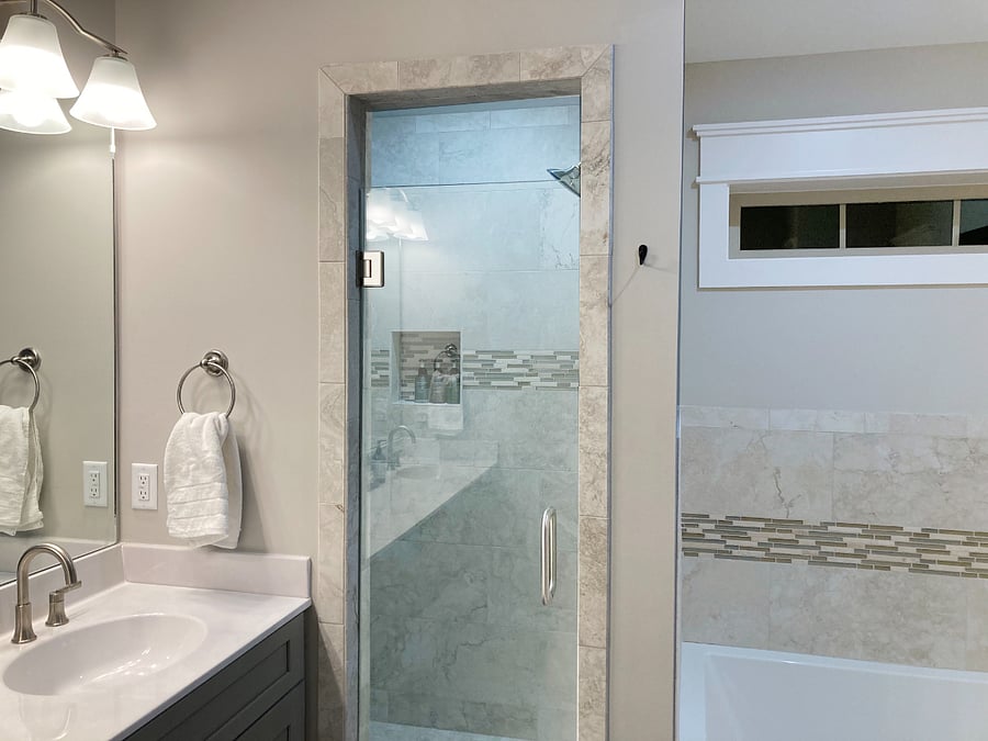 Large master bathroom has separate bath and shower. Two sinks and private toilet.