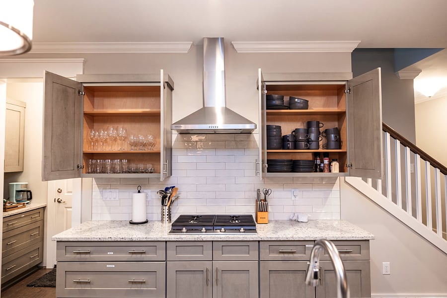 Modern, fully stocked kitchen with stainless steel appliances.