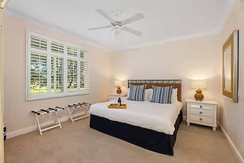 Master en-suite with king bed overlooking garden.