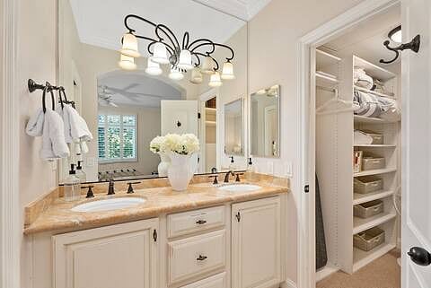 Dual sinks with large walk in closet.