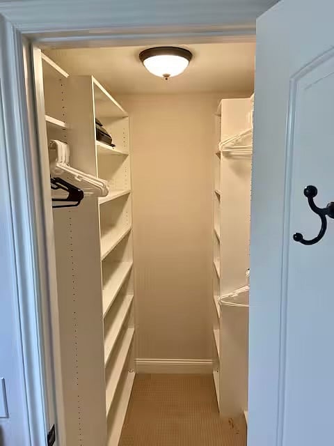 Large walk in closet with built-in dresser (you can't see dresser from this picture.)