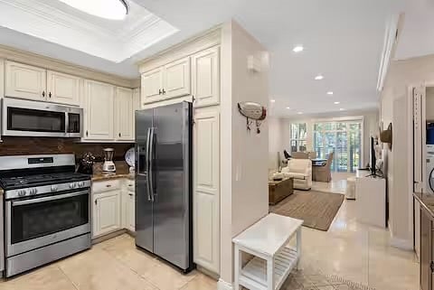 Fully stocked kitchen with everything you need to make a gourmet meal. Dual door refrigerator, microwave and gas stove.