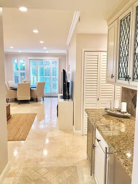 Entry into your new beach house. Welcome home! Travertine flooring throughout.