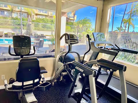 Community gym overlooking pool.