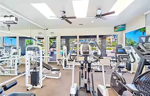 Community gym overlooking pool.